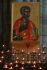 St Peter Candles burning under an icon in front of the choir screen Exeter Catheral